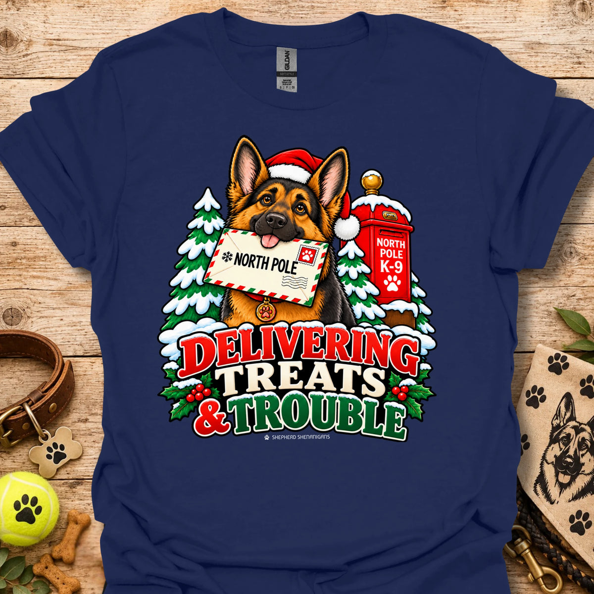 Navy T-shirt with colorful dog and holiday "Delivering Treats & Trouble" graphic