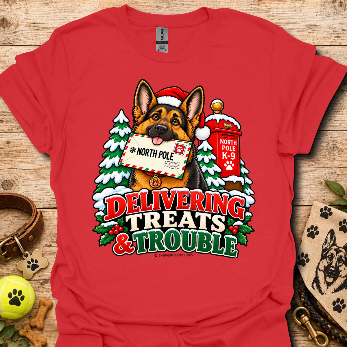 Red T-shirt with colorful dog and holiday "Delivering Treats & Trouble" graphic
