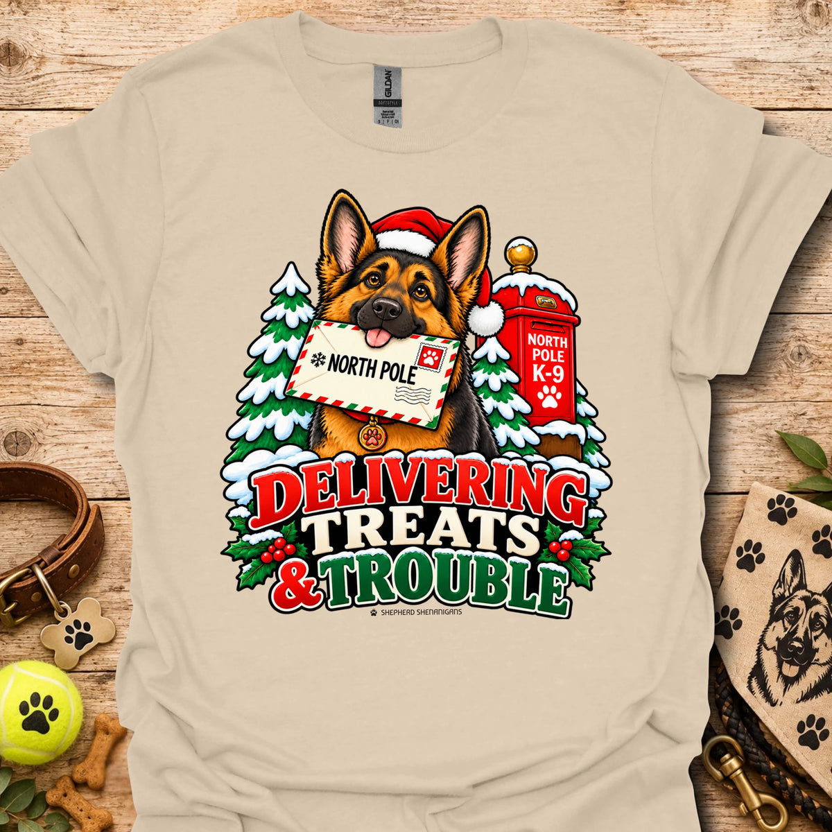 Sand T-shirt with colorful dog and holiday "Delivering Treats & Trouble" graphic