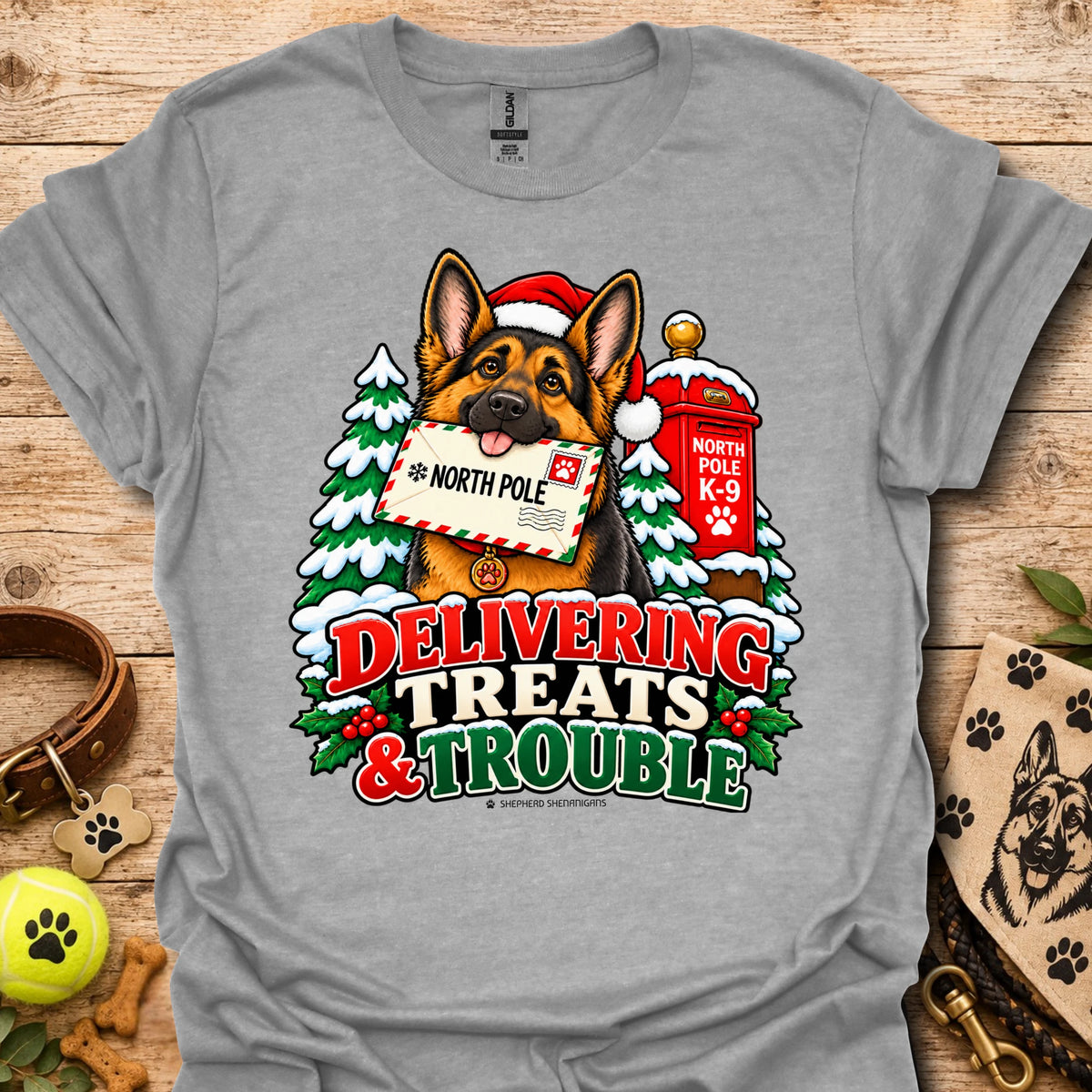 Sport grey T-shirt with colorful dog and holiday "Delivering Treats & Trouble" graphic