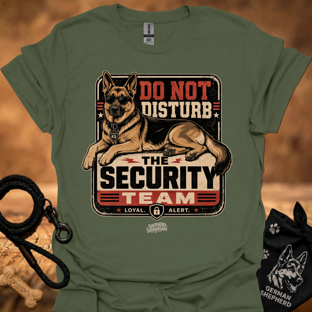 Military green graphic T-shirt with security dog and "Do Not Disturb" text