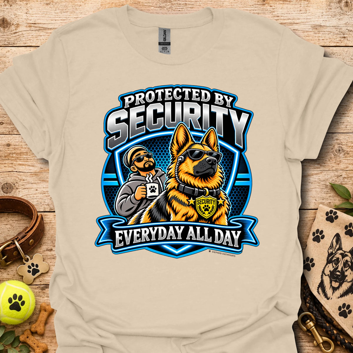 Sand T-shirt with a security guard and dog graphic and “Protected by Security” text