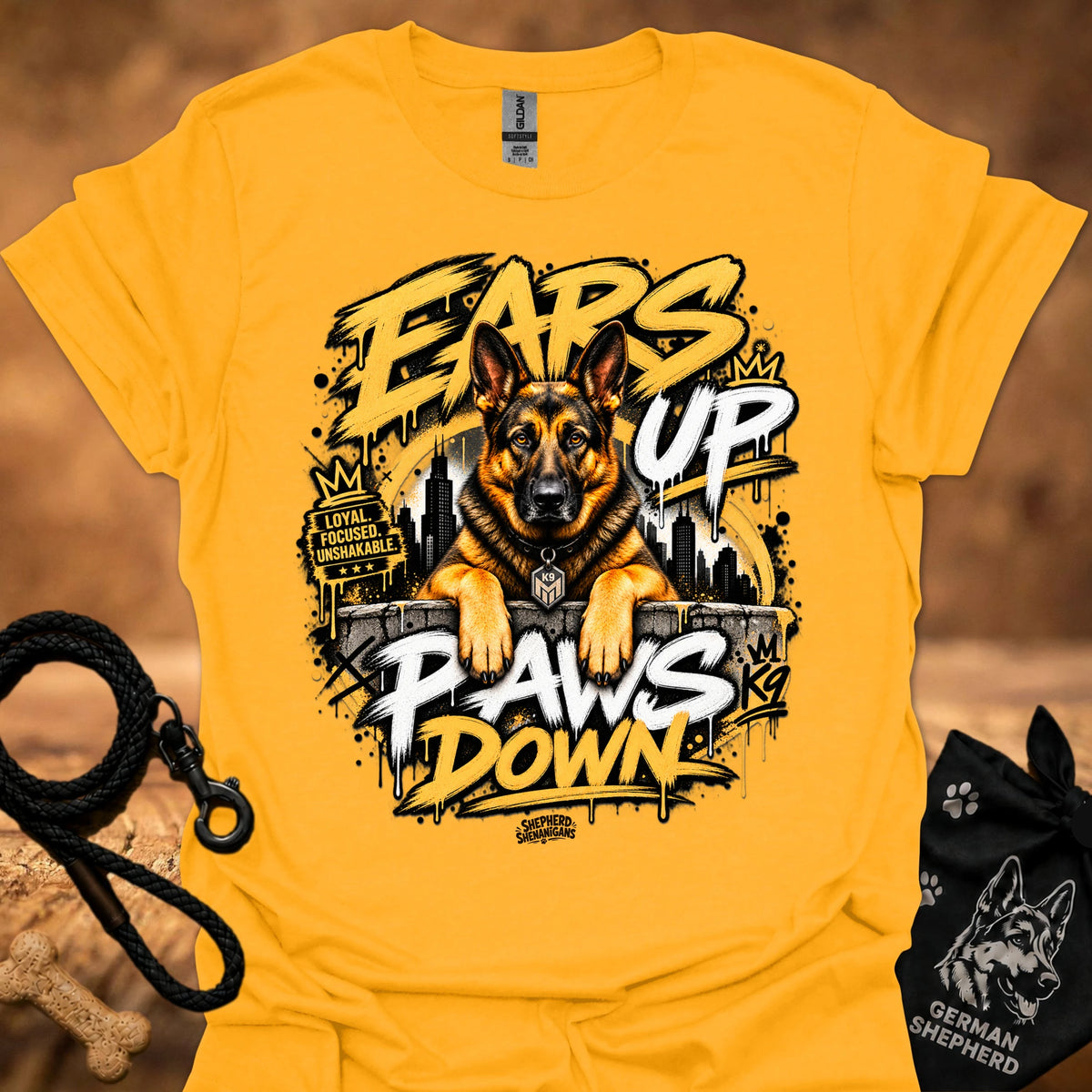 Gold t-shirt featuring a German shepherd “Ears Up Paws Down” graphic print.