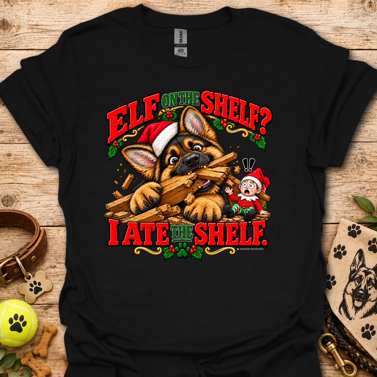 Black graphic t-shirt with cat-and-wood “Elf on the Shelf?” and “I ate the shelf” print