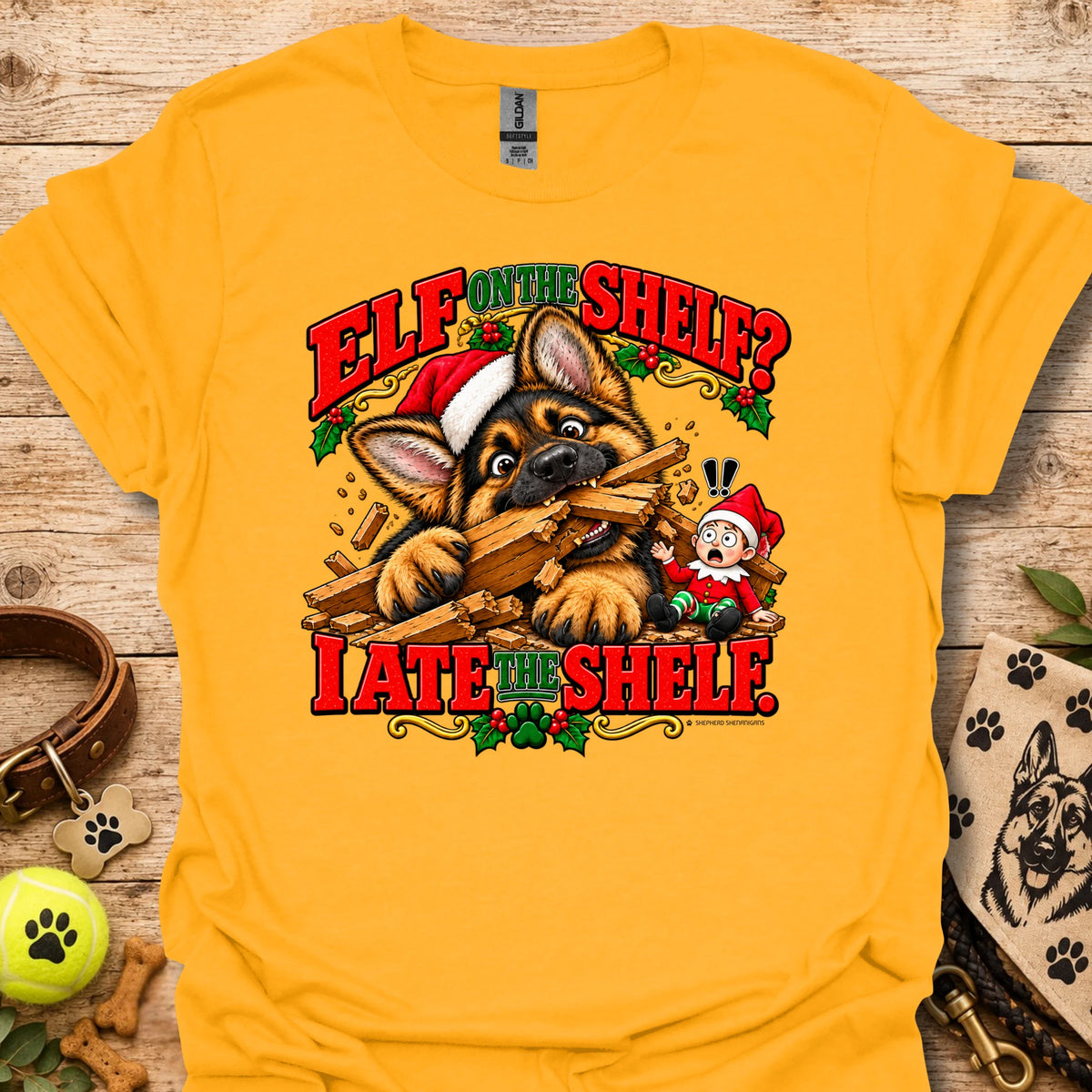Mustard yellow graphic t-shirt with cat-and-wood “Elf on the Shelf?” and “I ate the shelf” print
