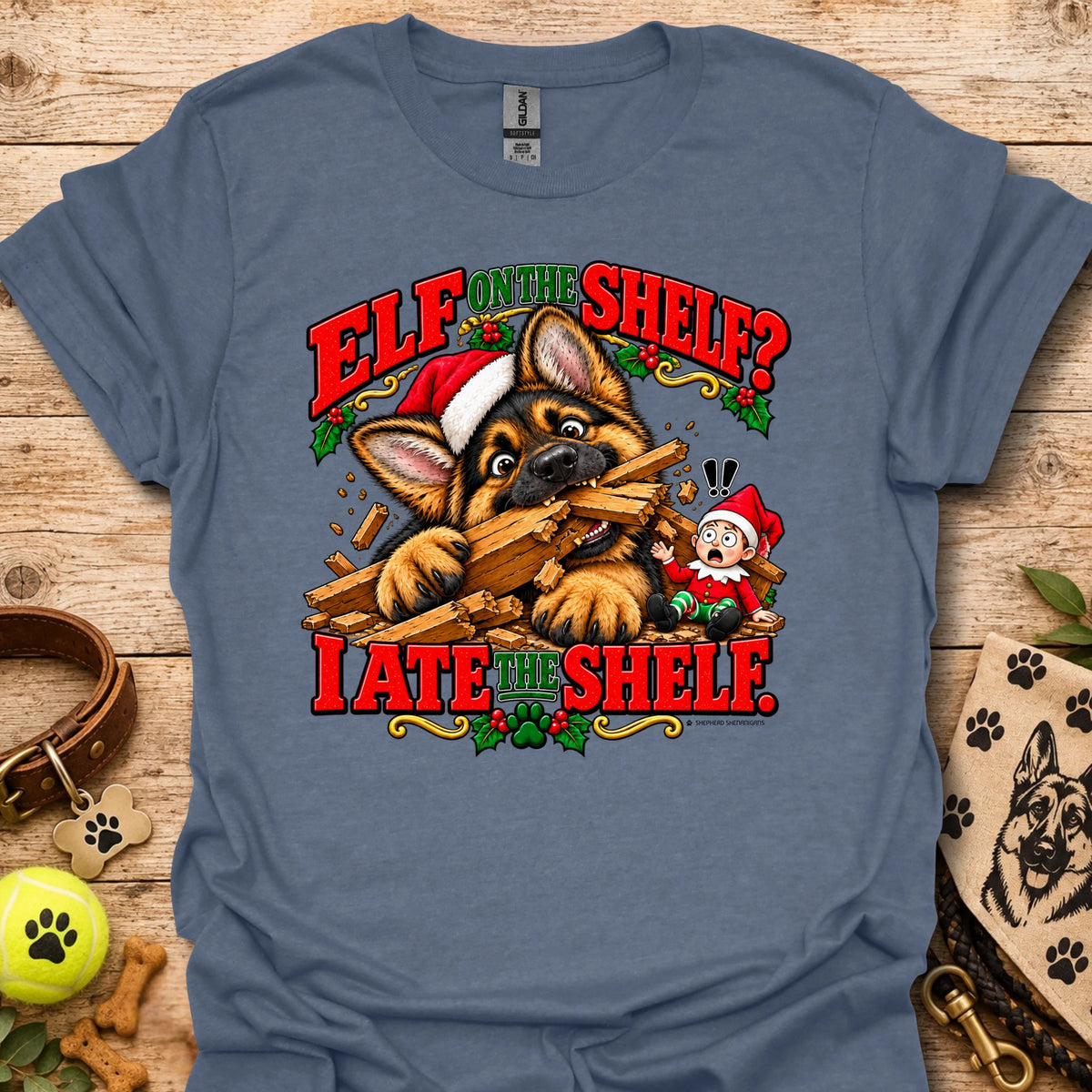 Light blue graphic t-shirt with cat-and-wood “Elf on the Shelf?” and “I ate the shelf” print
