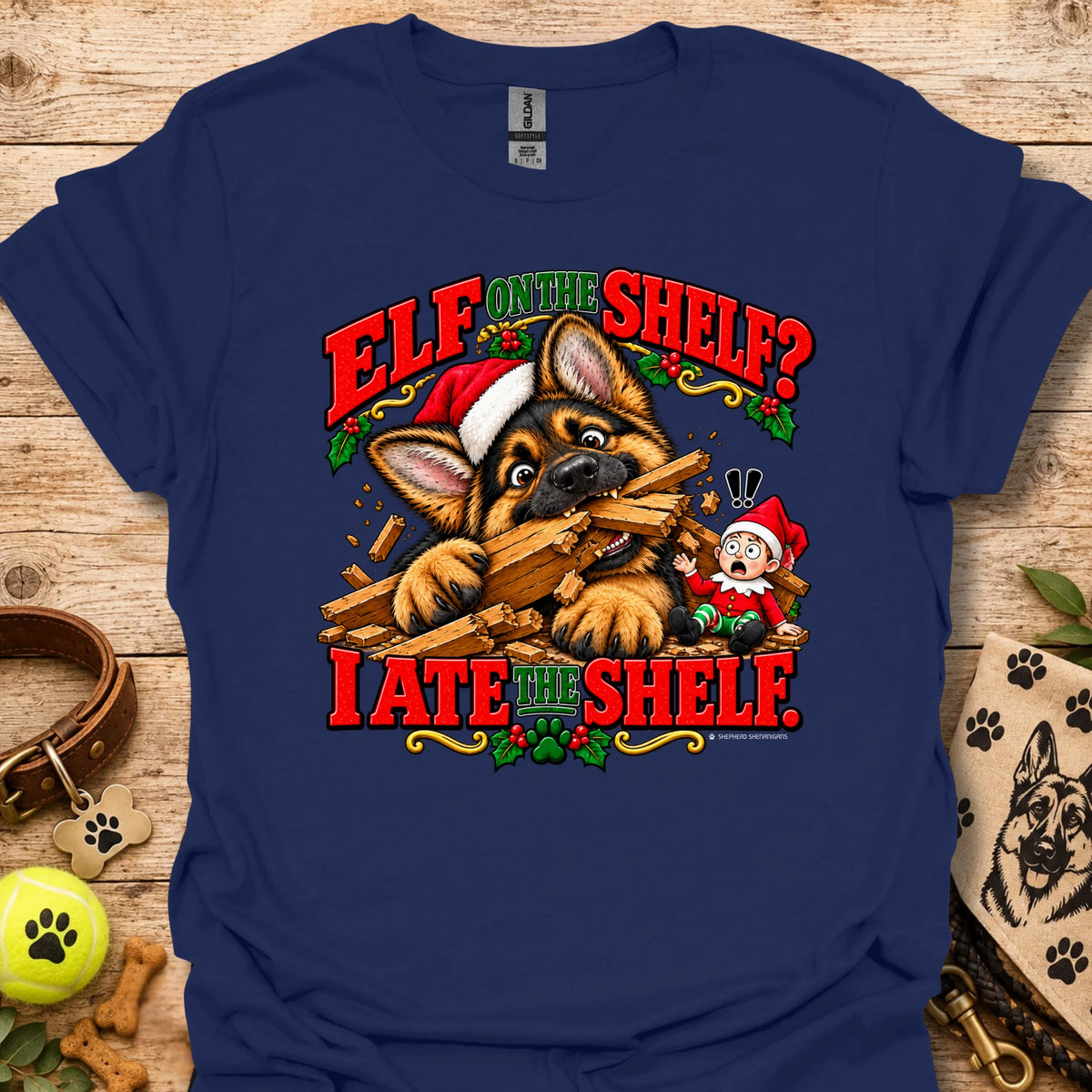 Navy graphic t-shirt with cat-and-wood “Elf on the Shelf?” and “I ate the shelf” print