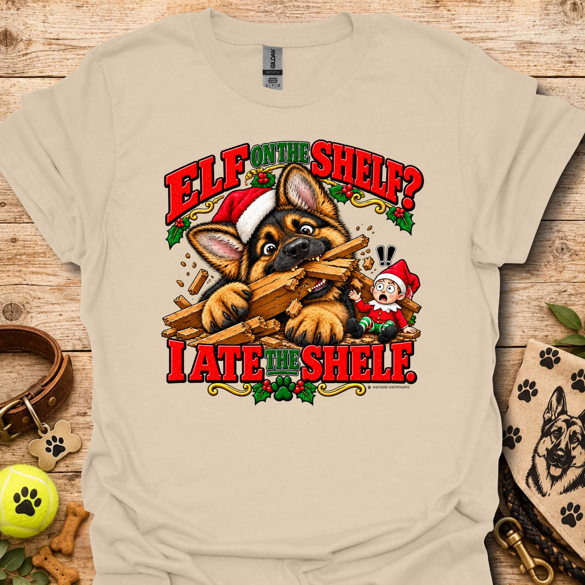 Oatmeal beige graphic t-shirt with cat-and-wood “Elf on the Shelf?” and “I ate the shelf” print
