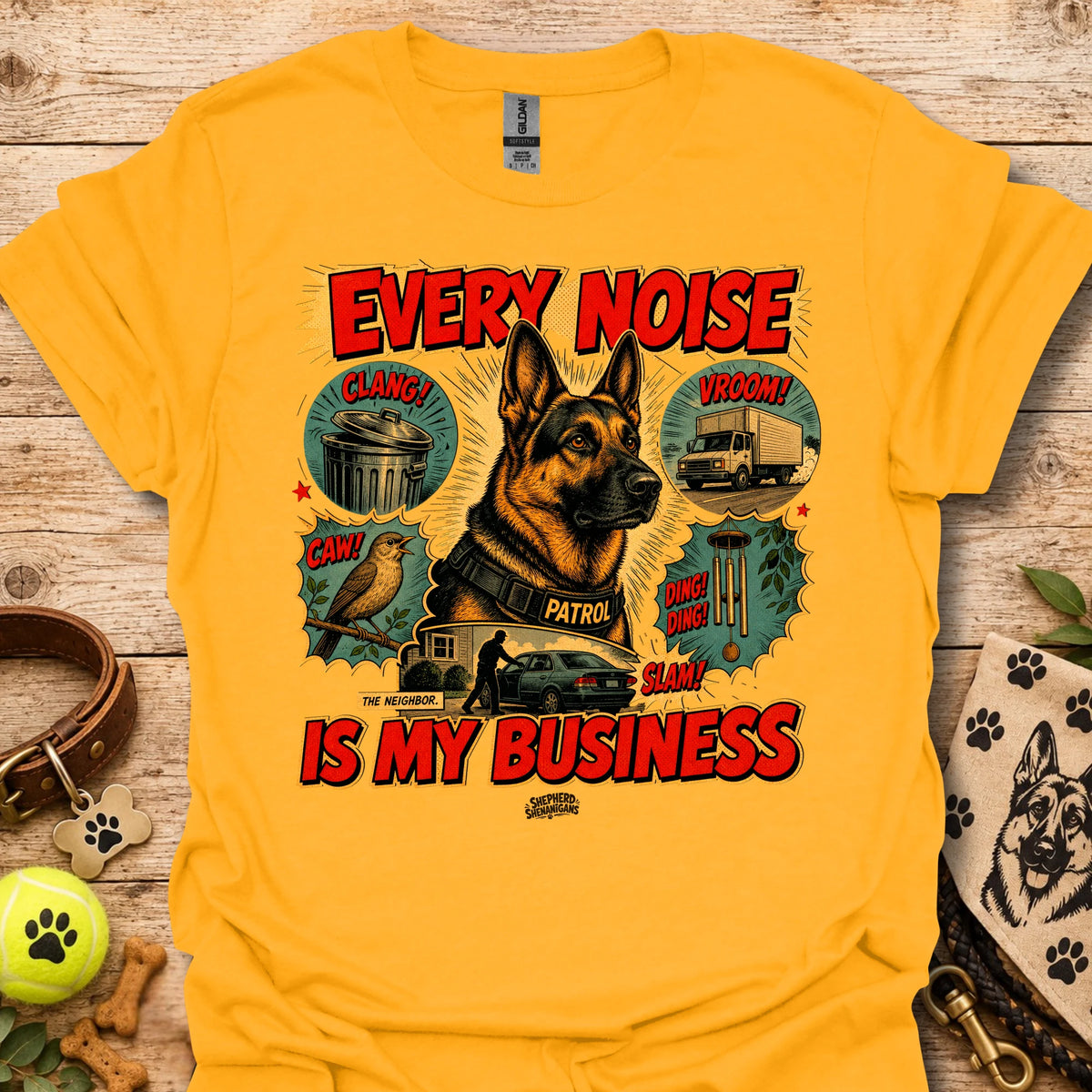 Gold graphic T-shirt with dog print and 'EVERY NOISE IS MY BUSINESS' text