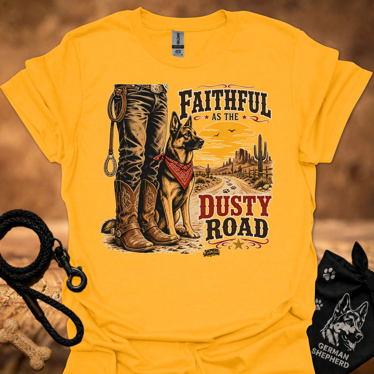 Gold graphic cowboy T-shirt with boots, dog, and “Dusty Road” lettering