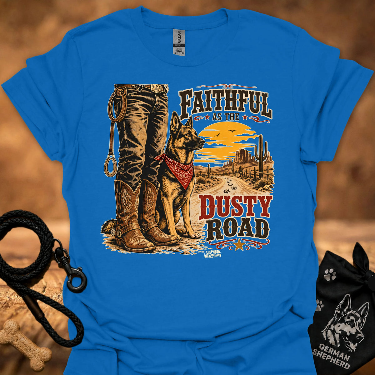 Royal blue graphic cowboy T-shirt with boots, dog, and “Dusty Road” lettering