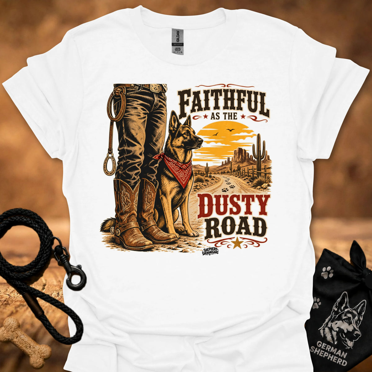 White graphic cowboy T-shirt with boots, dog, and “Dusty Road” lettering