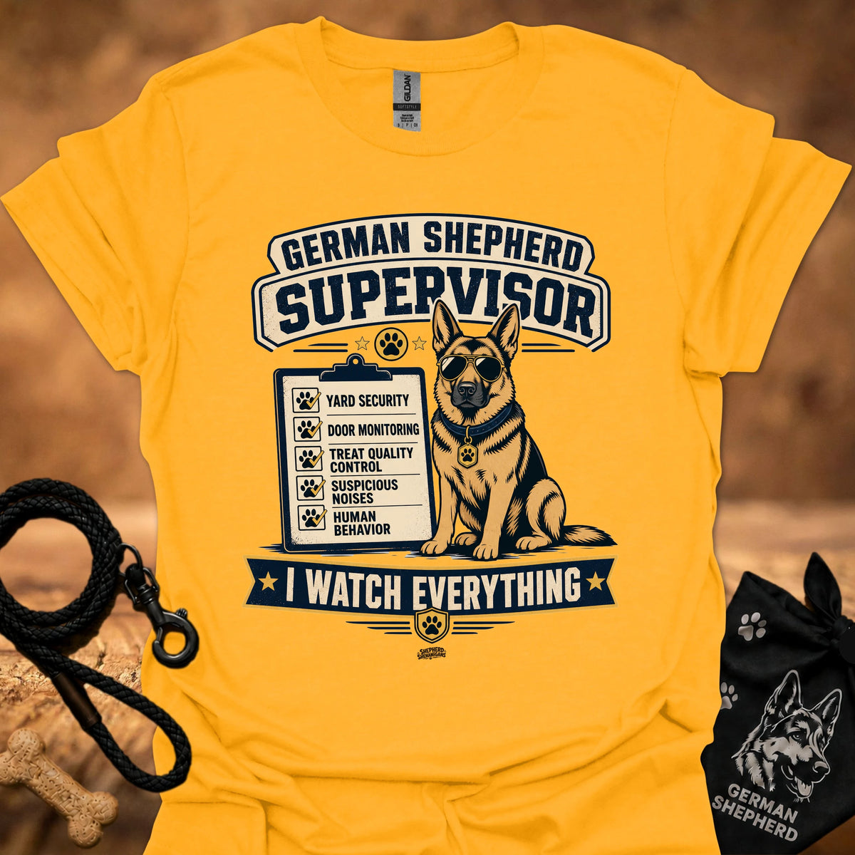 Gold crewneck T-shirt with German Shepherd Supervisor dog graphic and Watch Everything text