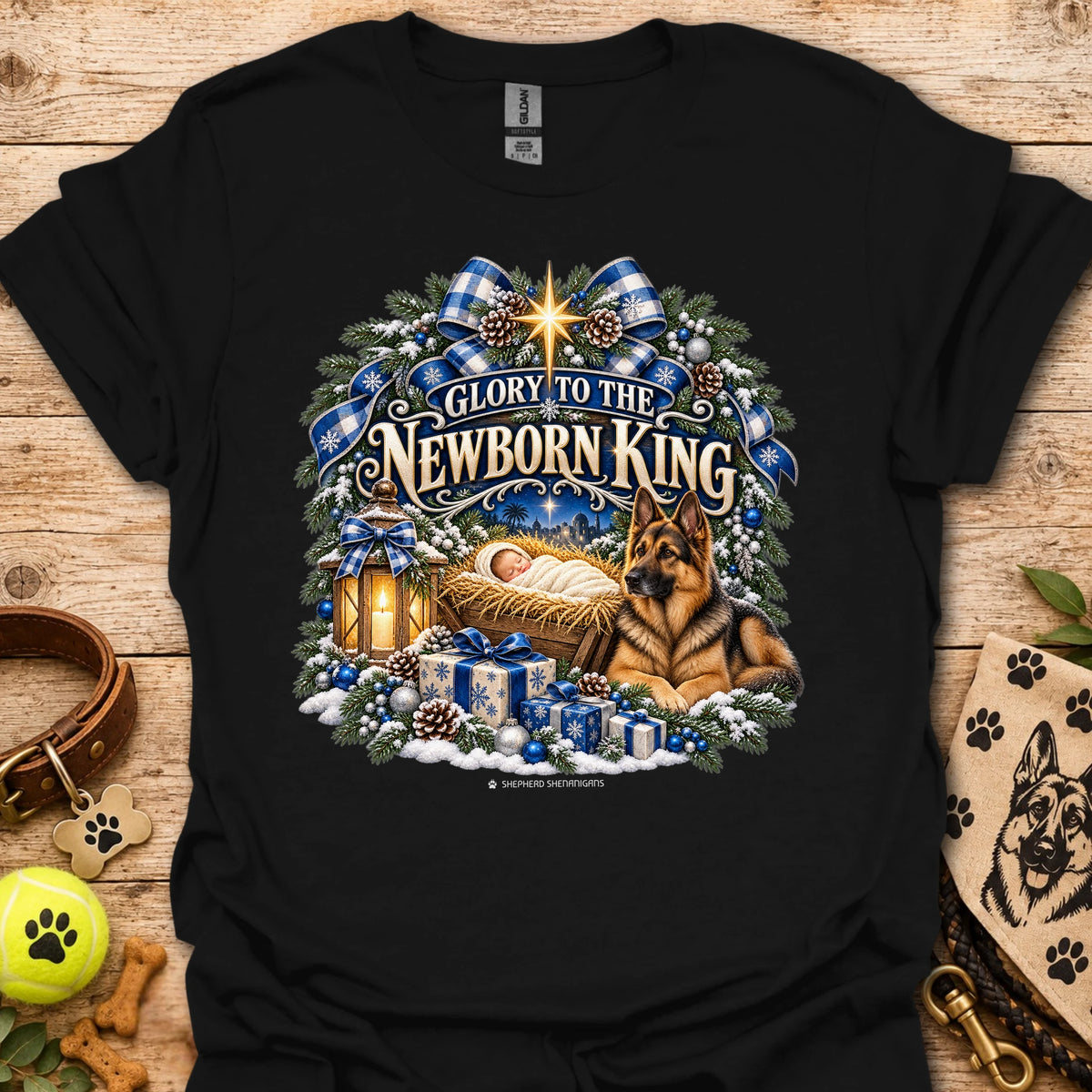 Black crew-neck T-shirt with blue holiday wreath nativity graphic
