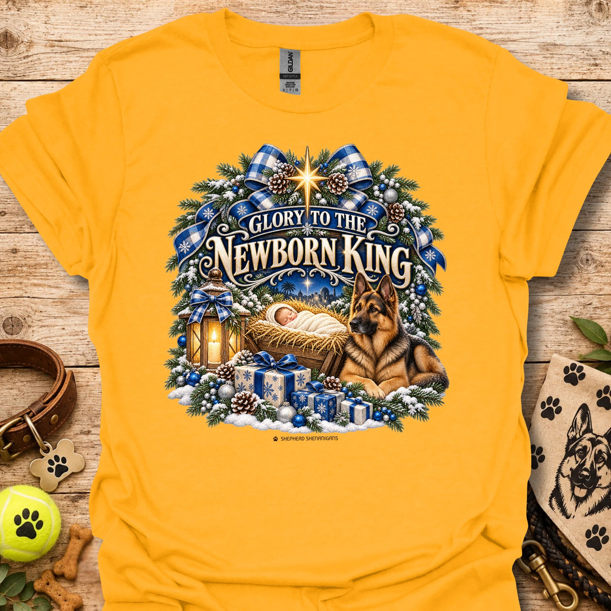 Gold crew-neck T-shirt with blue holiday wreath nativity graphic