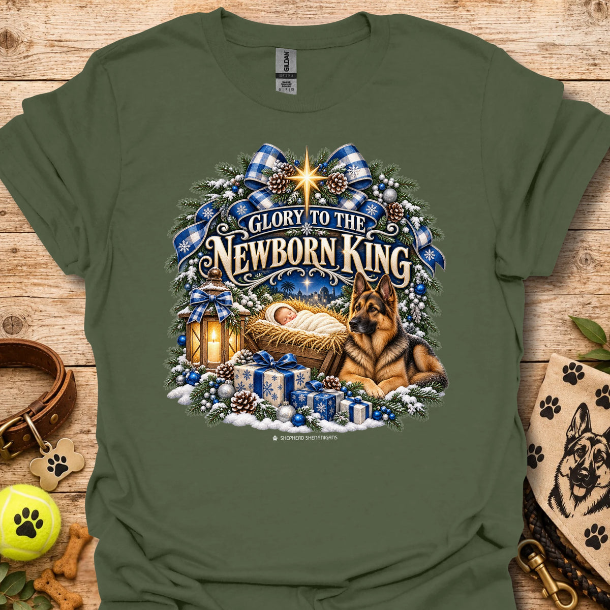 Military green crew-neck T-shirt with blue holiday wreath nativity graphic