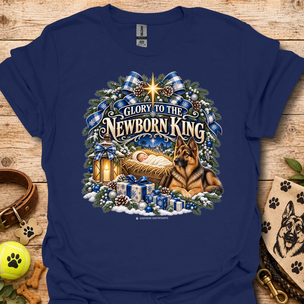 Navy crew-neck T-shirt with blue holiday wreath nativity graphic