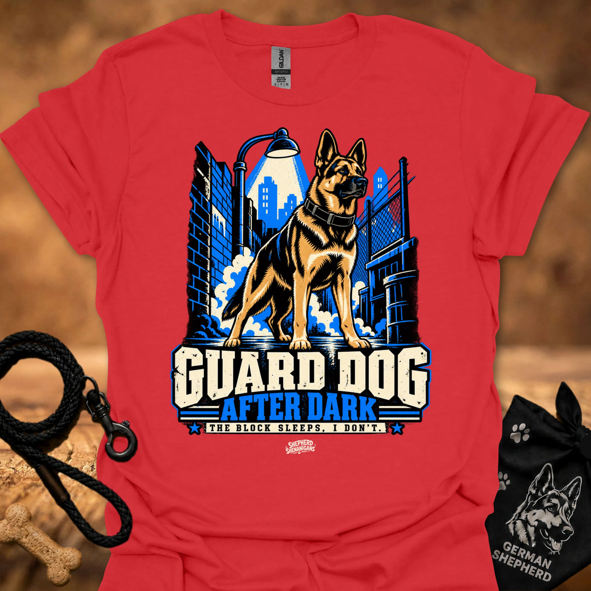 Red T-shirt with “Guard Dog After Dark” graphic featuring German shepherd and skyline