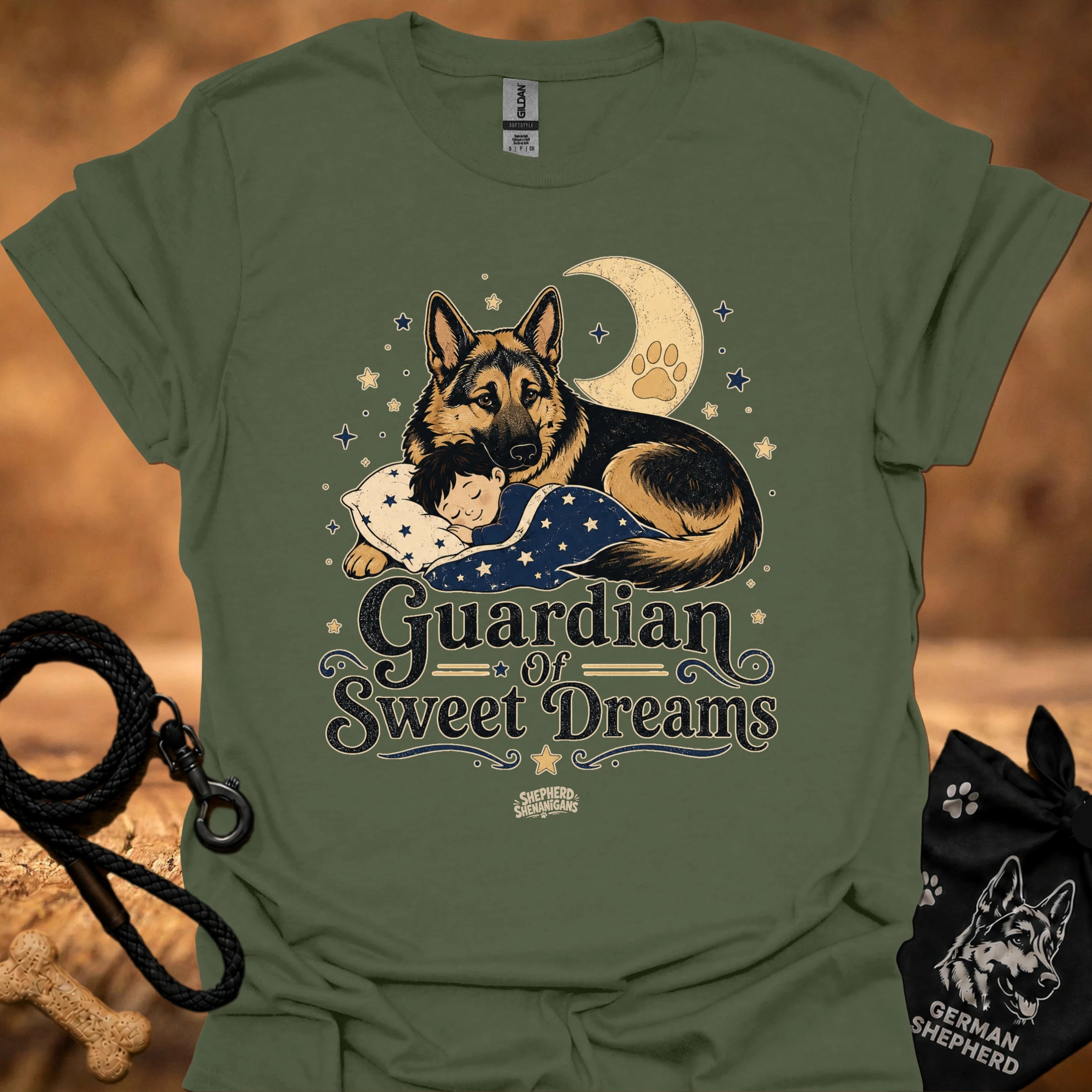 Military green T-shirt with front graphic of a German shepherd and sleeping child under moon