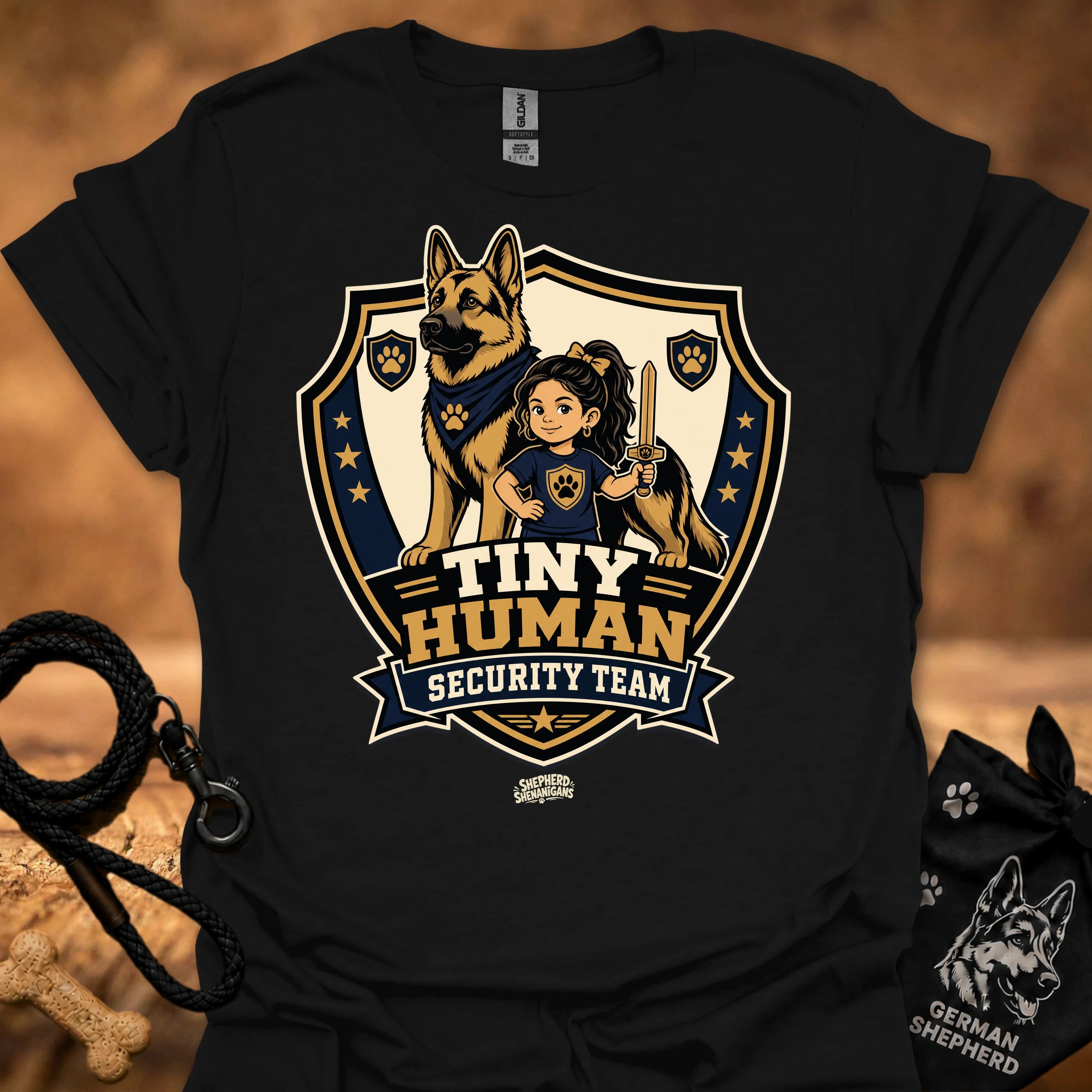 Black T-shirt with shield mascot graphic and “Tiny Human Security Team” print