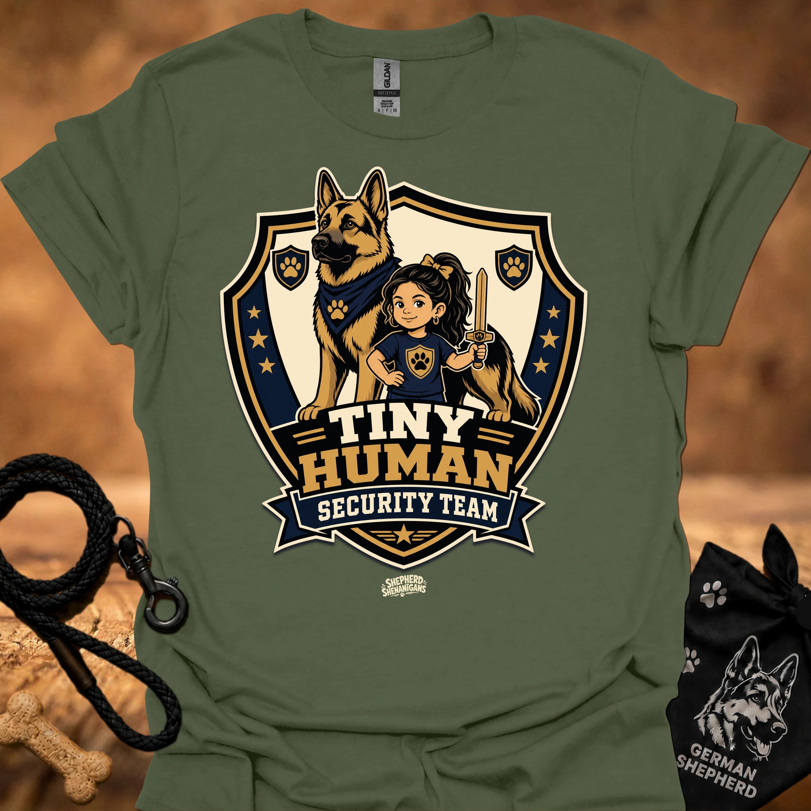 Military green T-shirt with shield mascot graphic and “Tiny Human Security Team” print