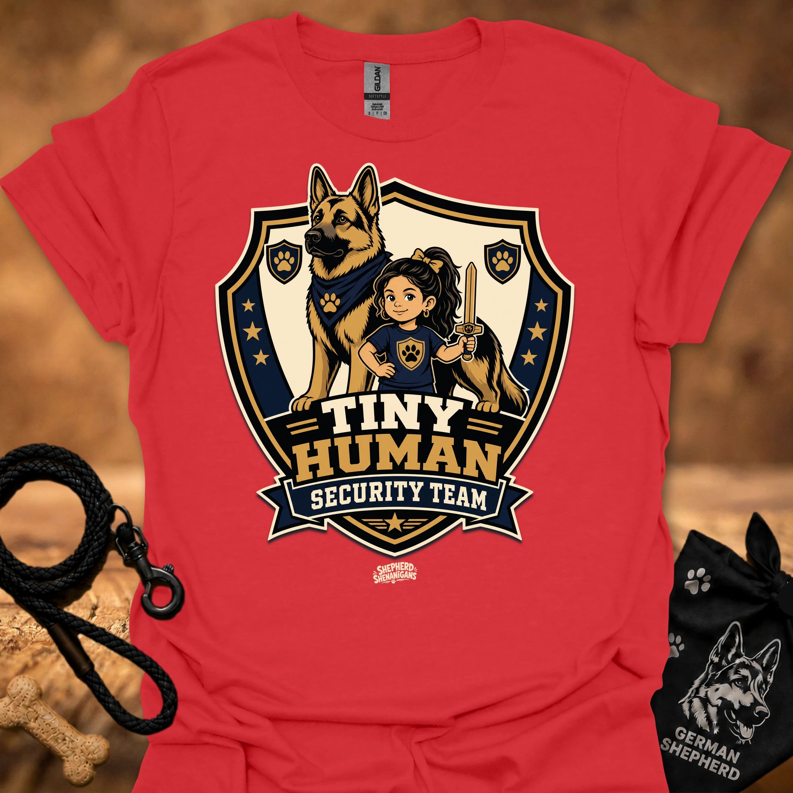 Red T-shirt with shield mascot graphic and “Tiny Human Security Team” print