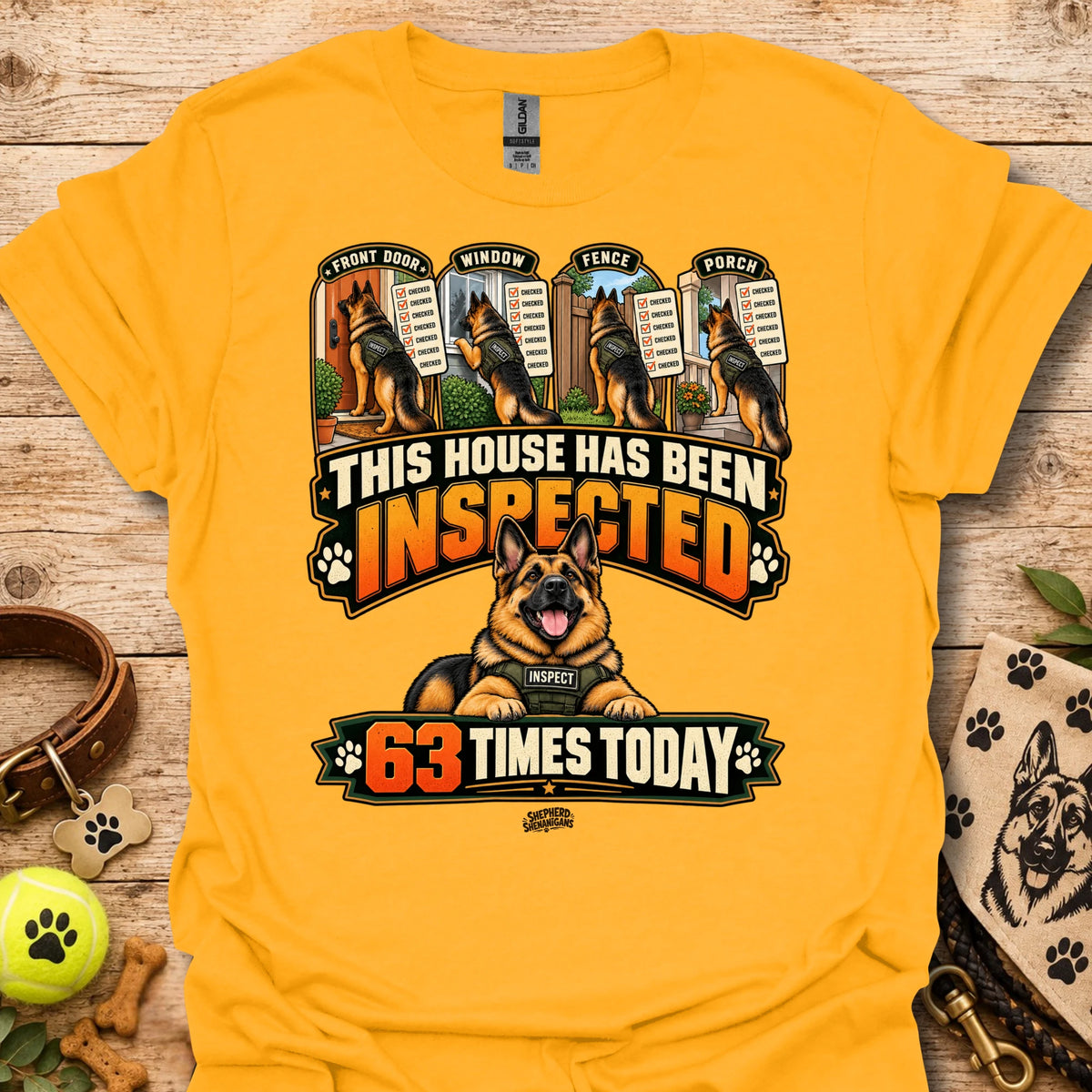 Gold T-shirt with inspected-house graphic: dog, badges, 63 times today text