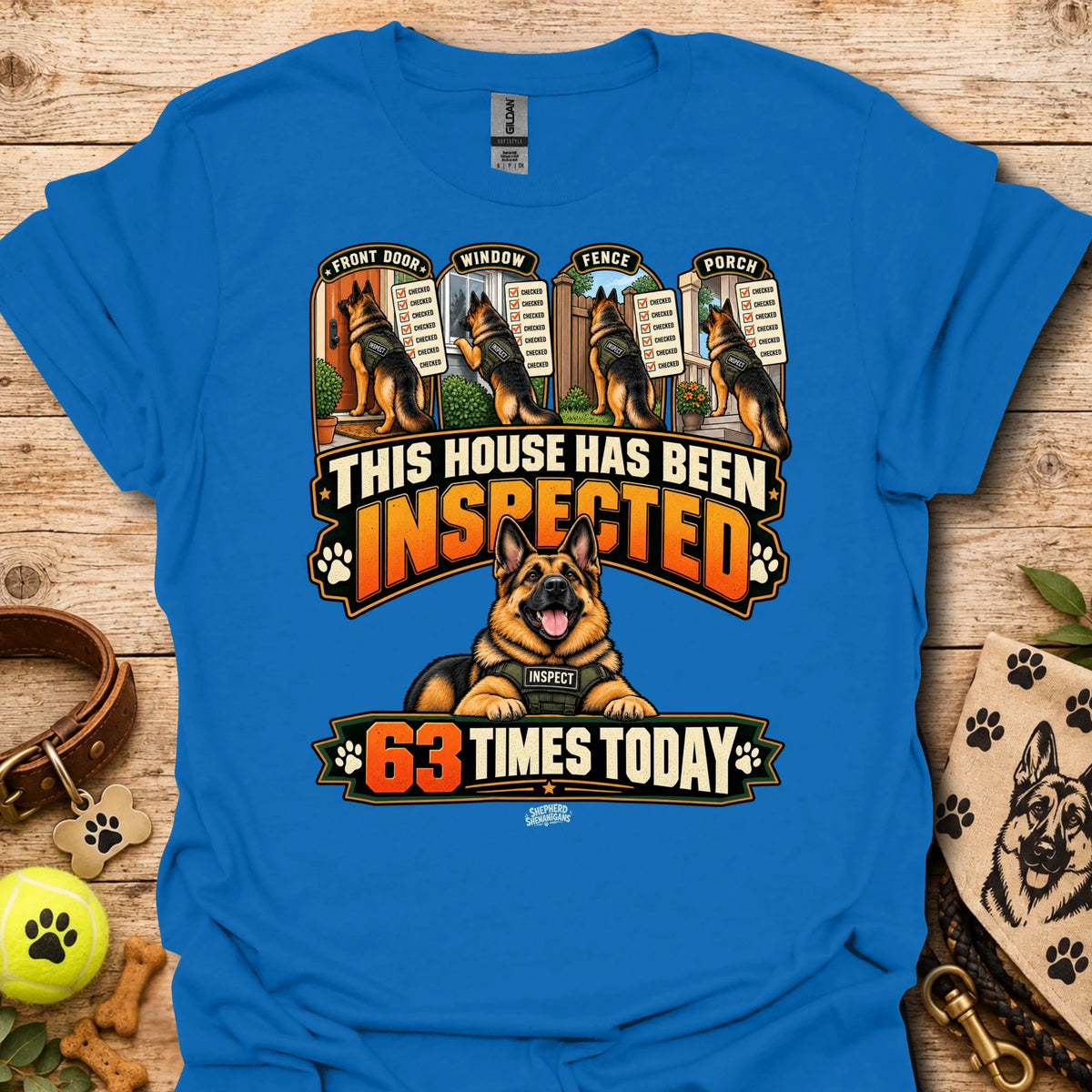 Royal blue T-shirt with inspected-house graphic: dog, badges, 63 times today text