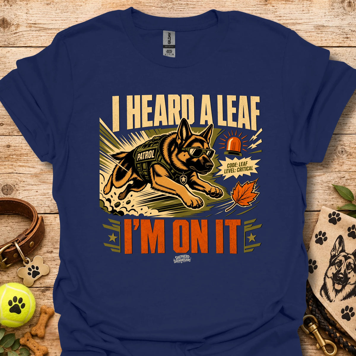 Royal blue t-shirt with dog leaf graphic and bold 'I HEARD A LEAF'/'I'M ON IT' text.