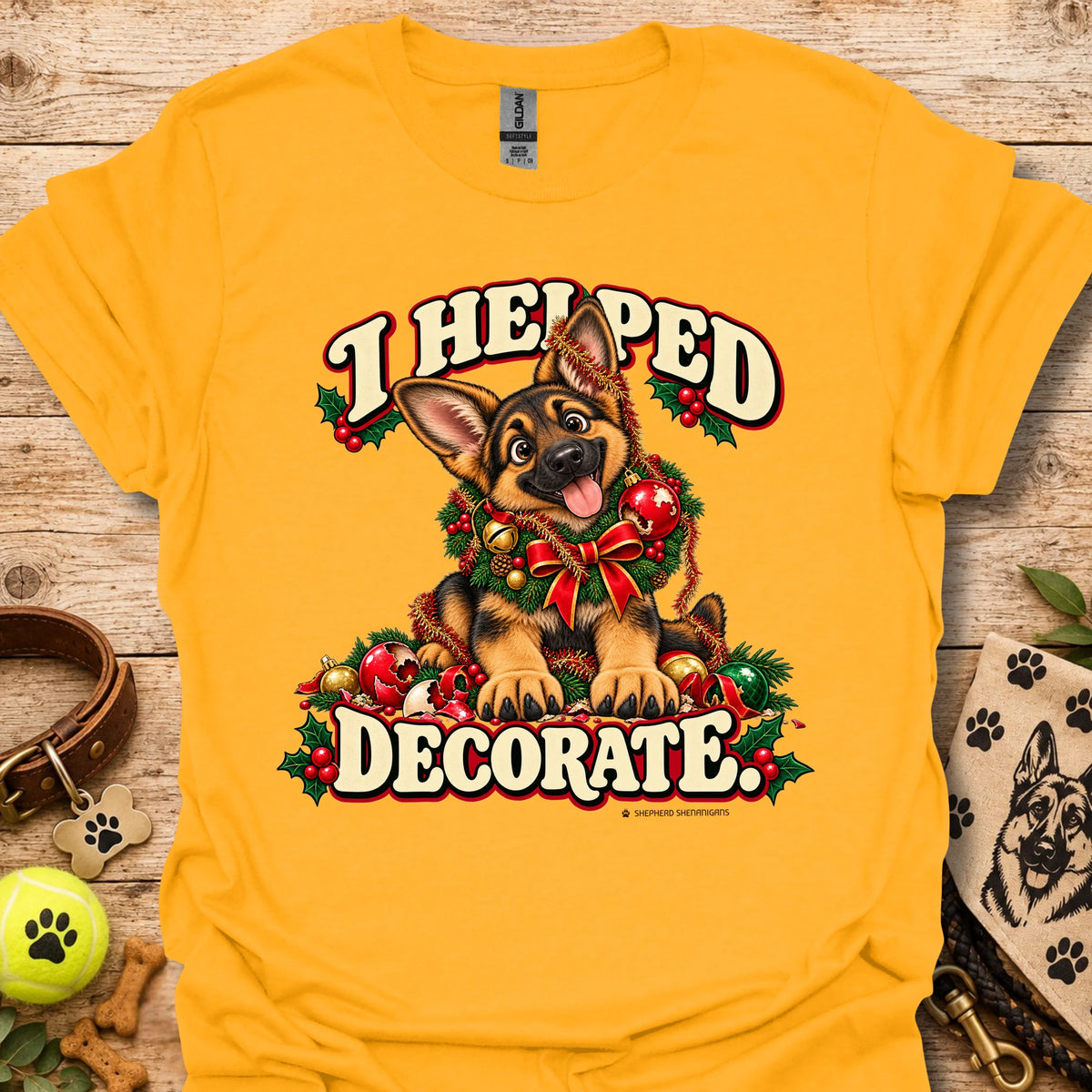 Gold T-shirt with festive cartoon dog and holiday text graphic on front