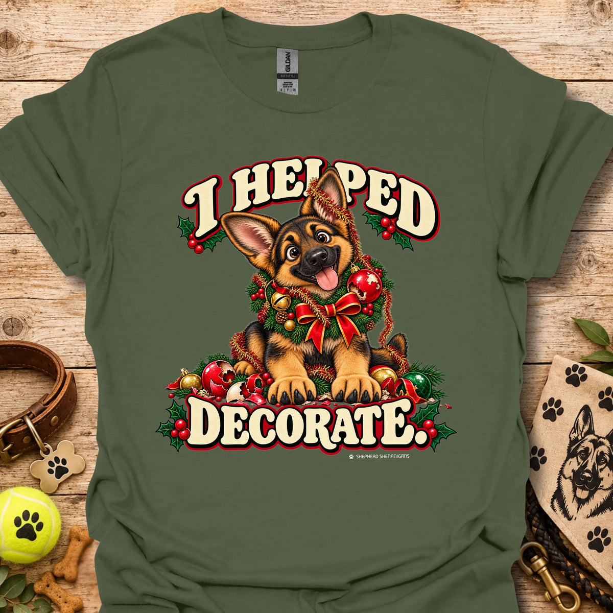 Military green T-shirt with festive cartoon dog and holiday text graphic on front