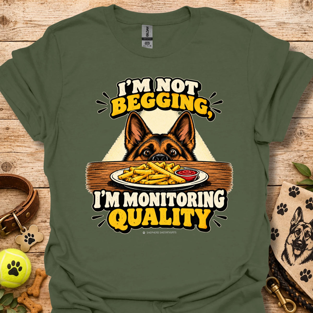 Military green t-shirt with dog head and “I'm Not Begging” front graphic, “I'm Monitoring Quality”