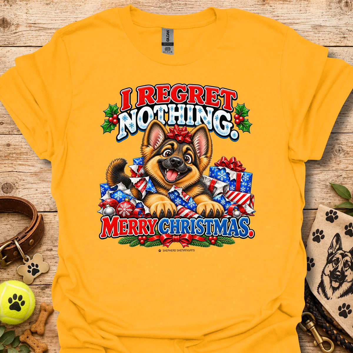 Dog Christmas graphic t-shirt, gold with colorful “I REGRET NOTHING” and “MERRY CHRISTMAS”