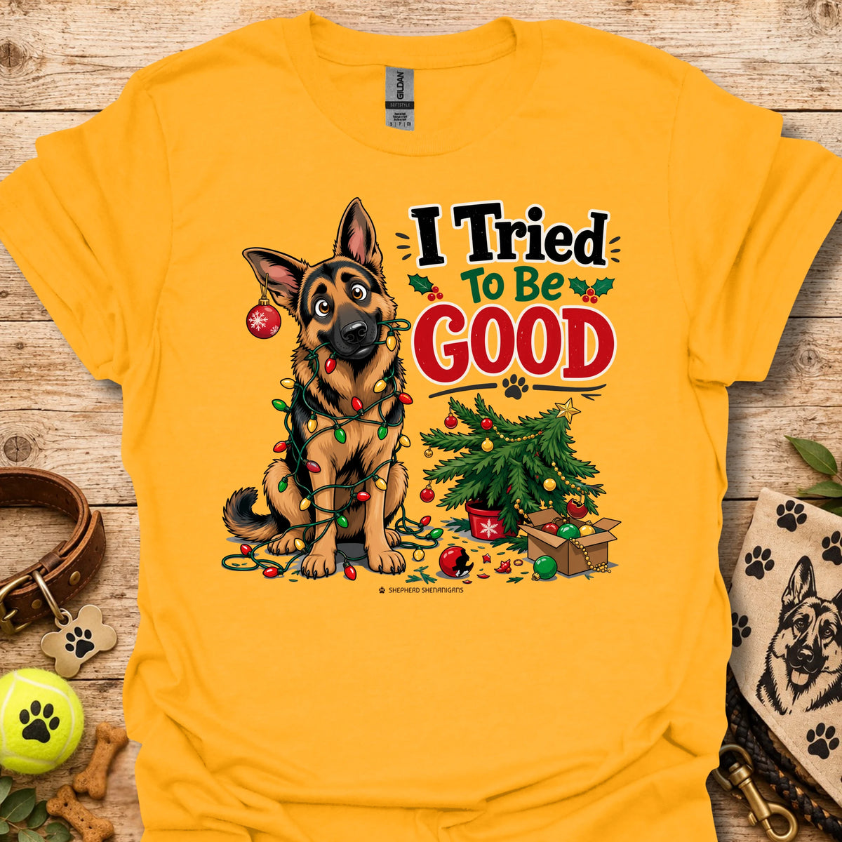 Gold T-shirt with cartoon German shepherd and “I Tried To Be Good” holiday graphic