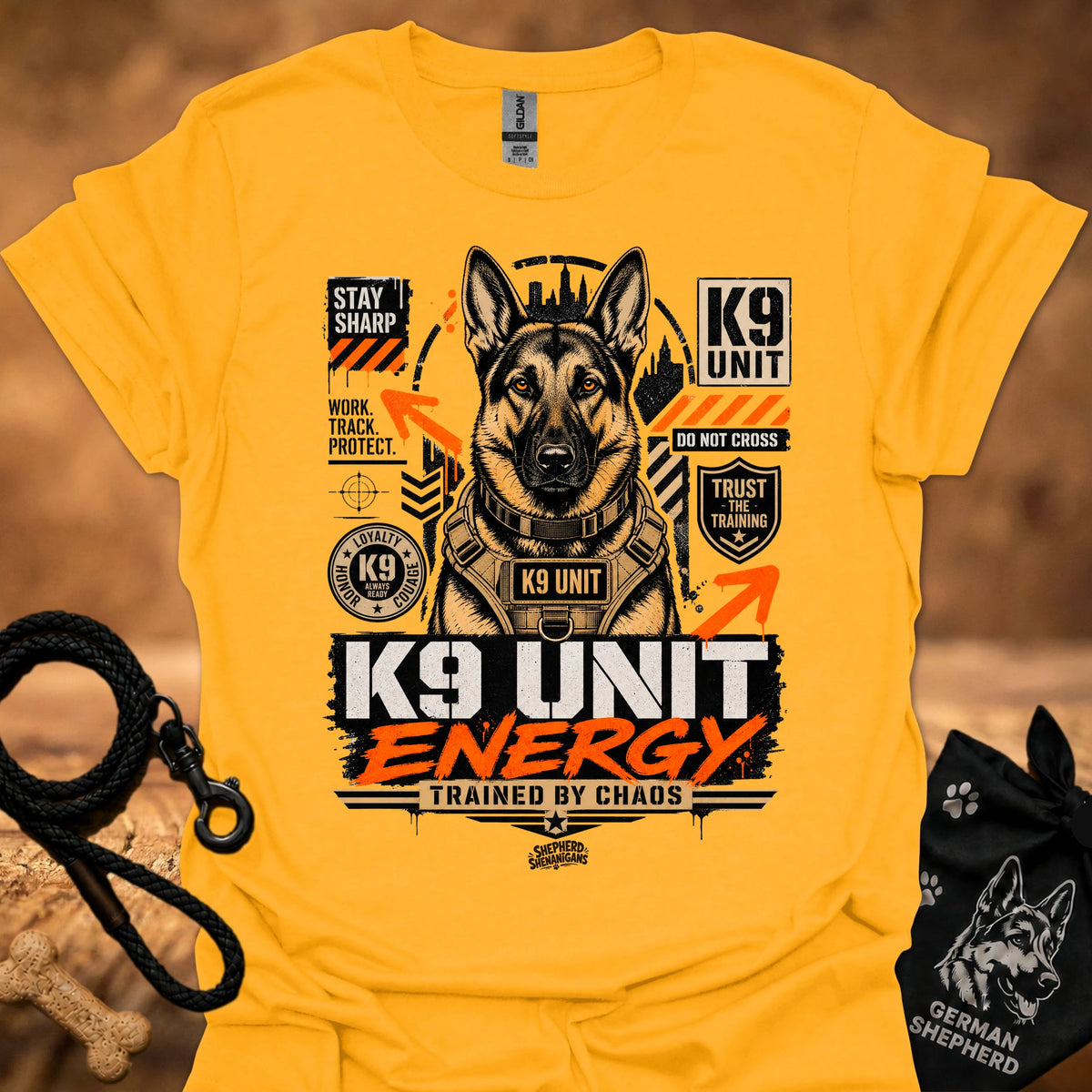 K9 Unit Energy T-shirt in Gold with K9 Unit dog graphic and 'trained by chaos' print.