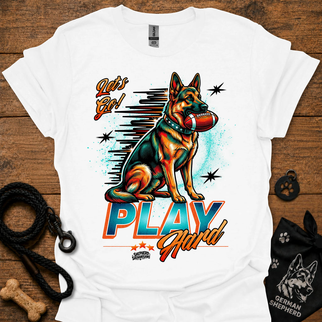 White dog graphic t-shirt with "PLAY" text and sitting German shepherd illustration