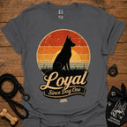 Charcoal gray dog silhouette graphic T-shirt with vintage-style badge emblem