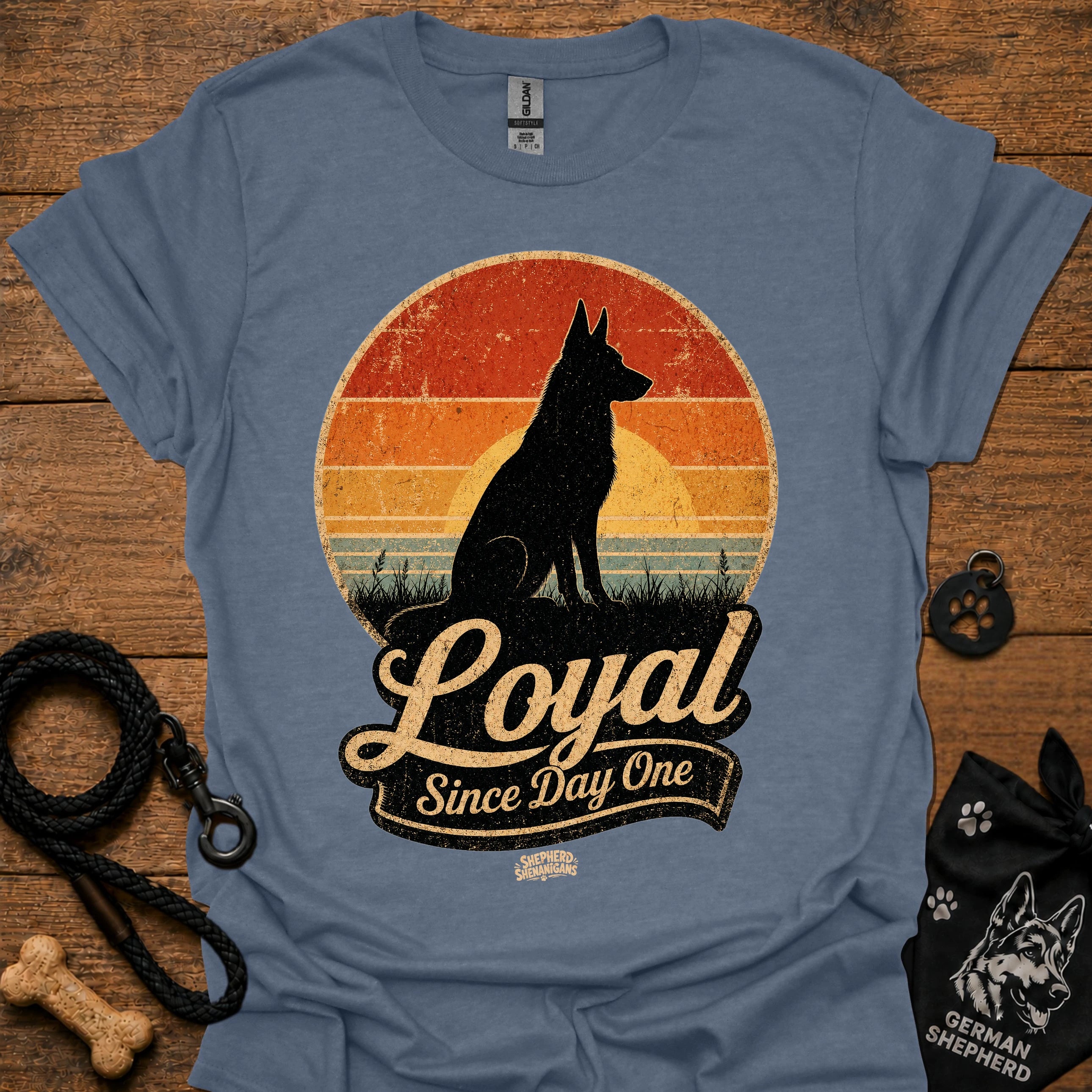 Dusty blue dog silhouette graphic T-shirt with vintage-style badge emblem