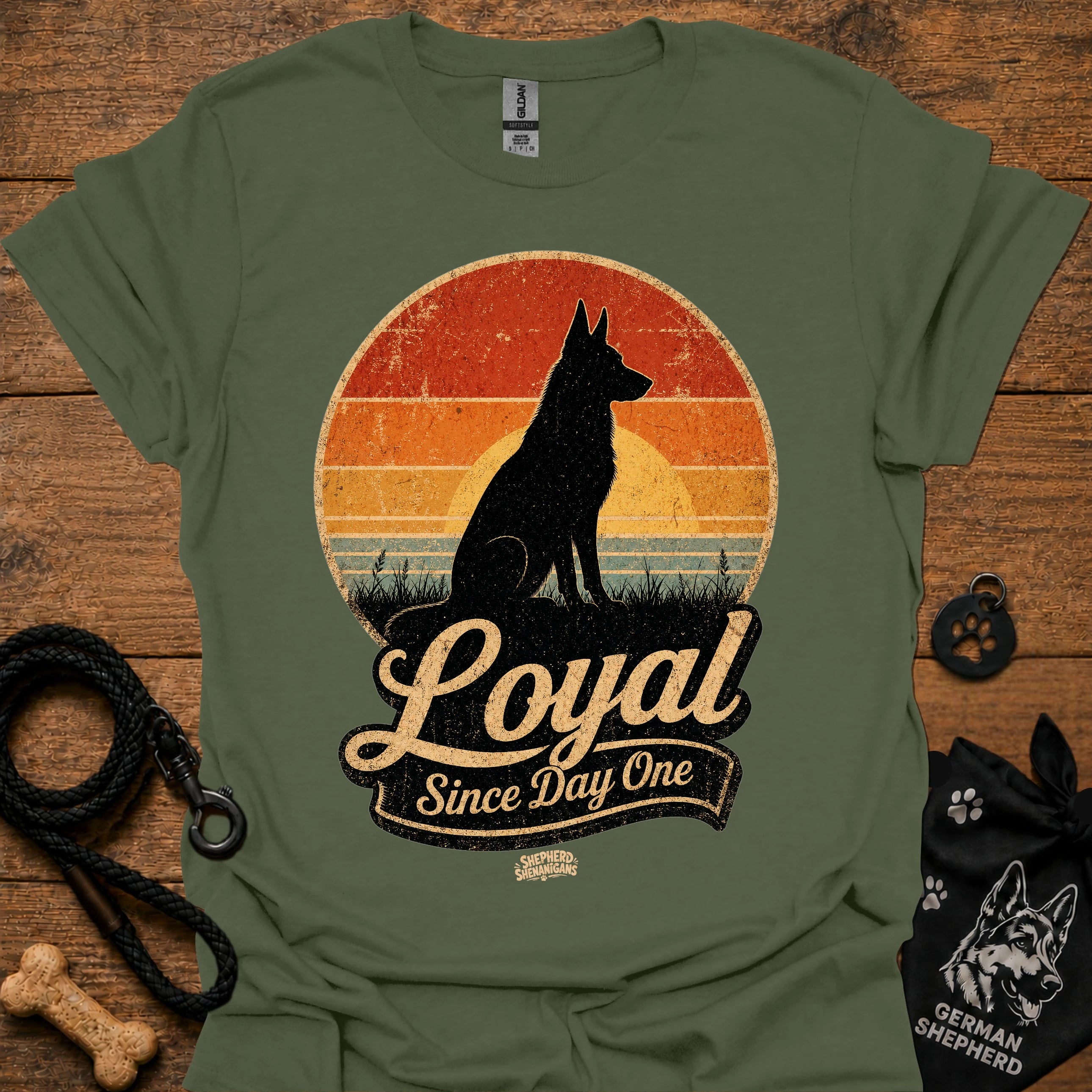 Olive green dog silhouette graphic T-shirt with vintage-style badge emblem