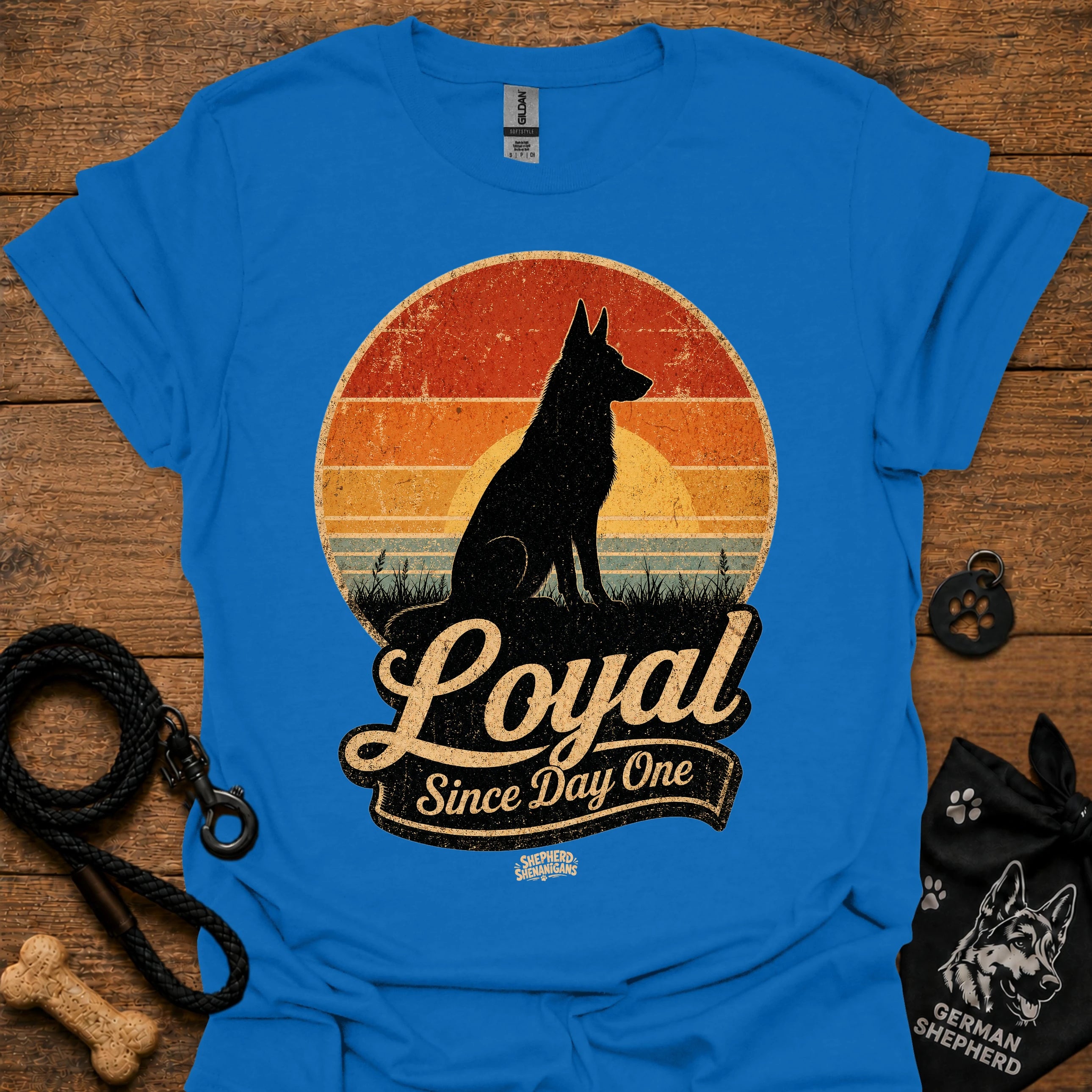 Royal blue dog silhouette graphic T-shirt with vintage-style badge emblem