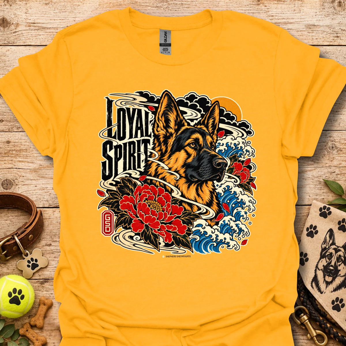 Gold Loyal Spirit T-shirt with wolf, floral, and wave graphic on front