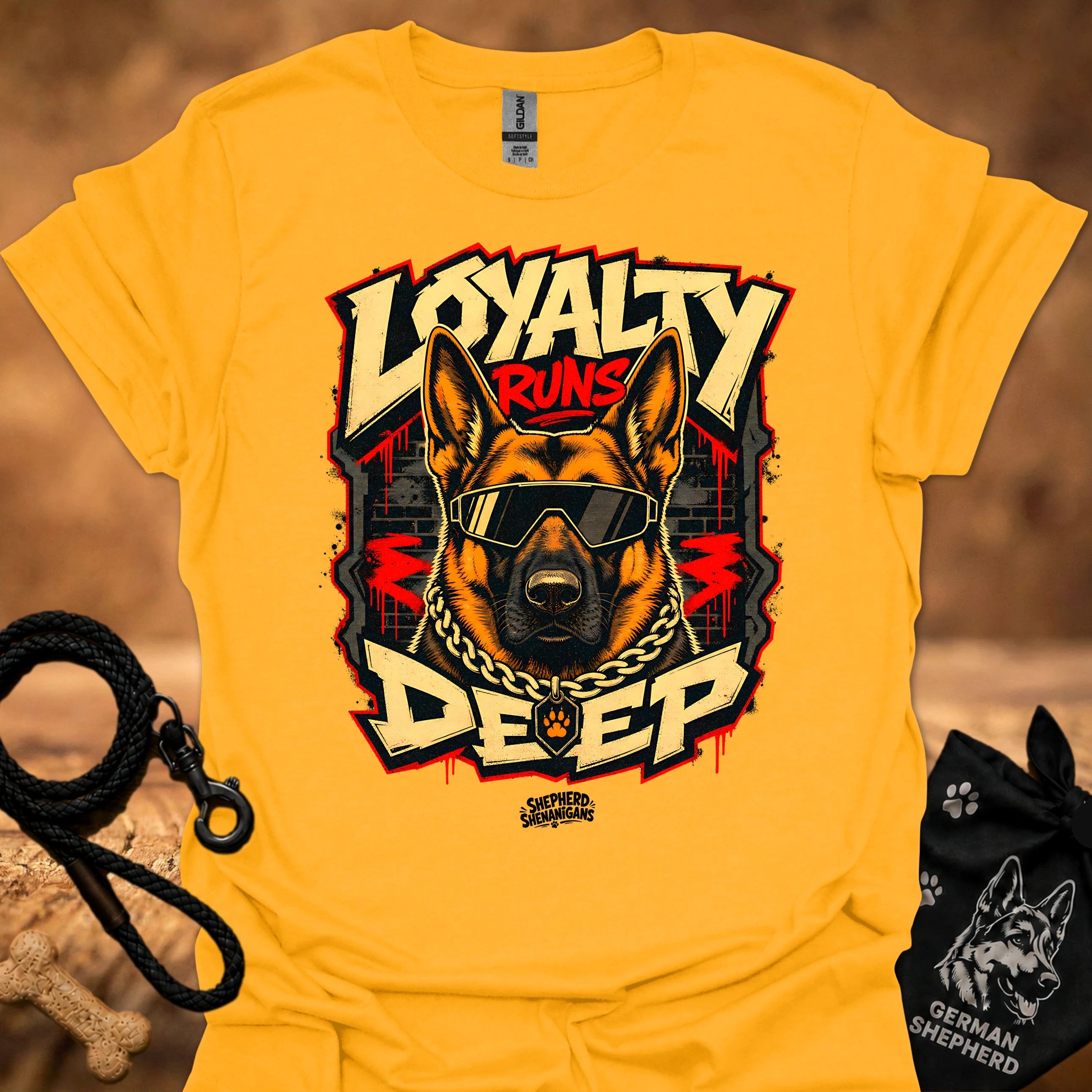Gold t-shirt with bold German shepherd wearing goggles and gold chain graphic