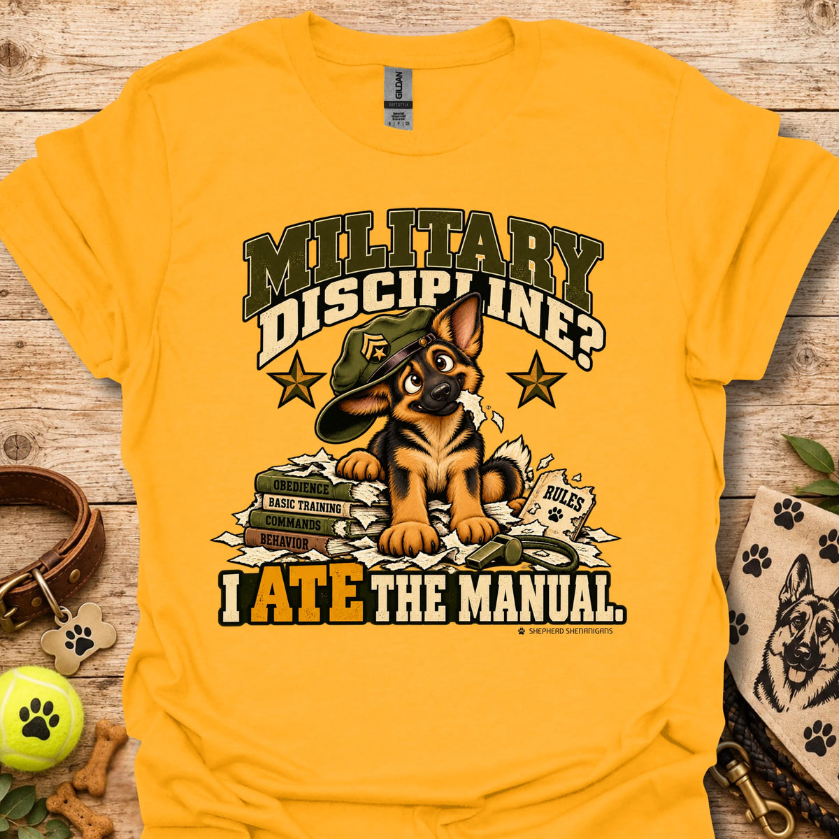 Gold crew-neck T-shirt with military dog graphic and “I Ate the Manual” print
