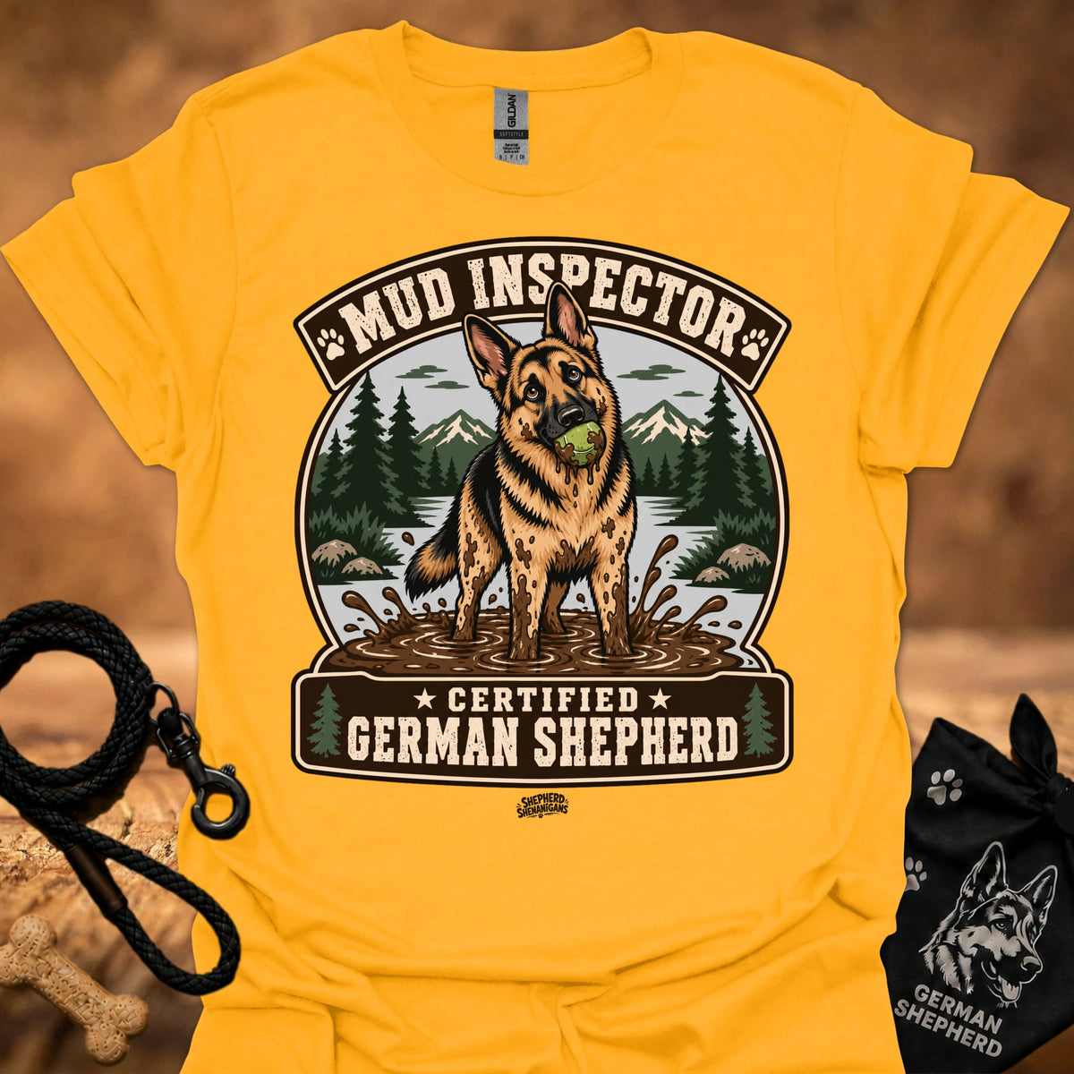 Gold/yellow T-shirt with chest graphic of German shepherd and Mud Inspector badge