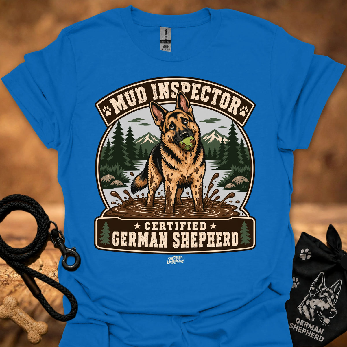 Blue T-shirt with chest graphic of German shepherd and Mud Inspector badge