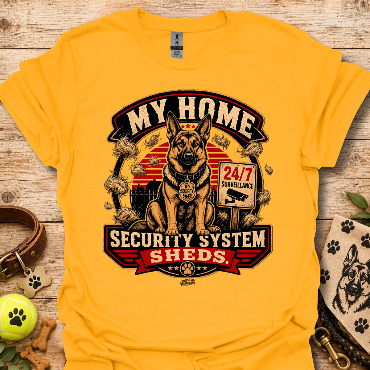 Gold t-shirt with centered dog security graphic and “Security System Sheds” text