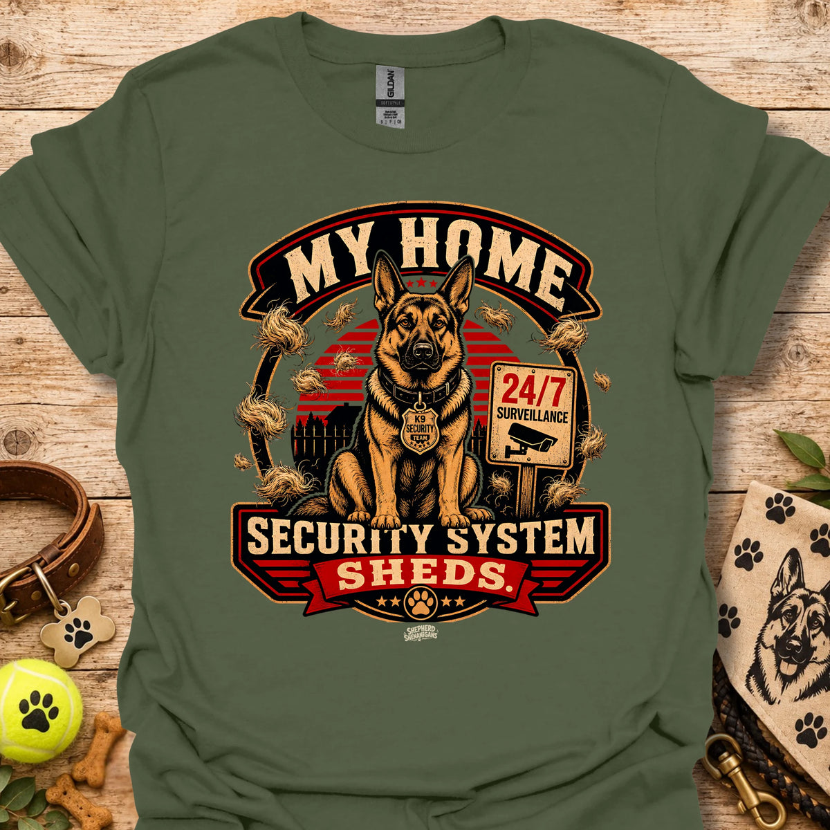 Military green t-shirt with centered dog security graphic and “Security System Sheds” text