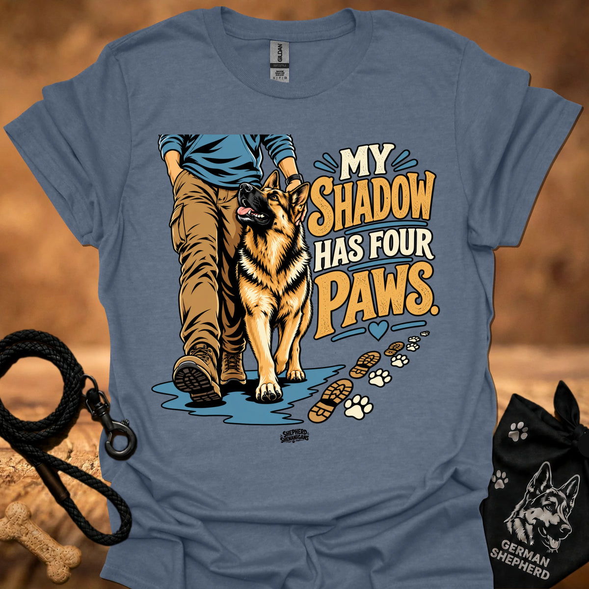 Blue-gray T-shirt with dog graphic and “My Shadow Has Four Paws” text