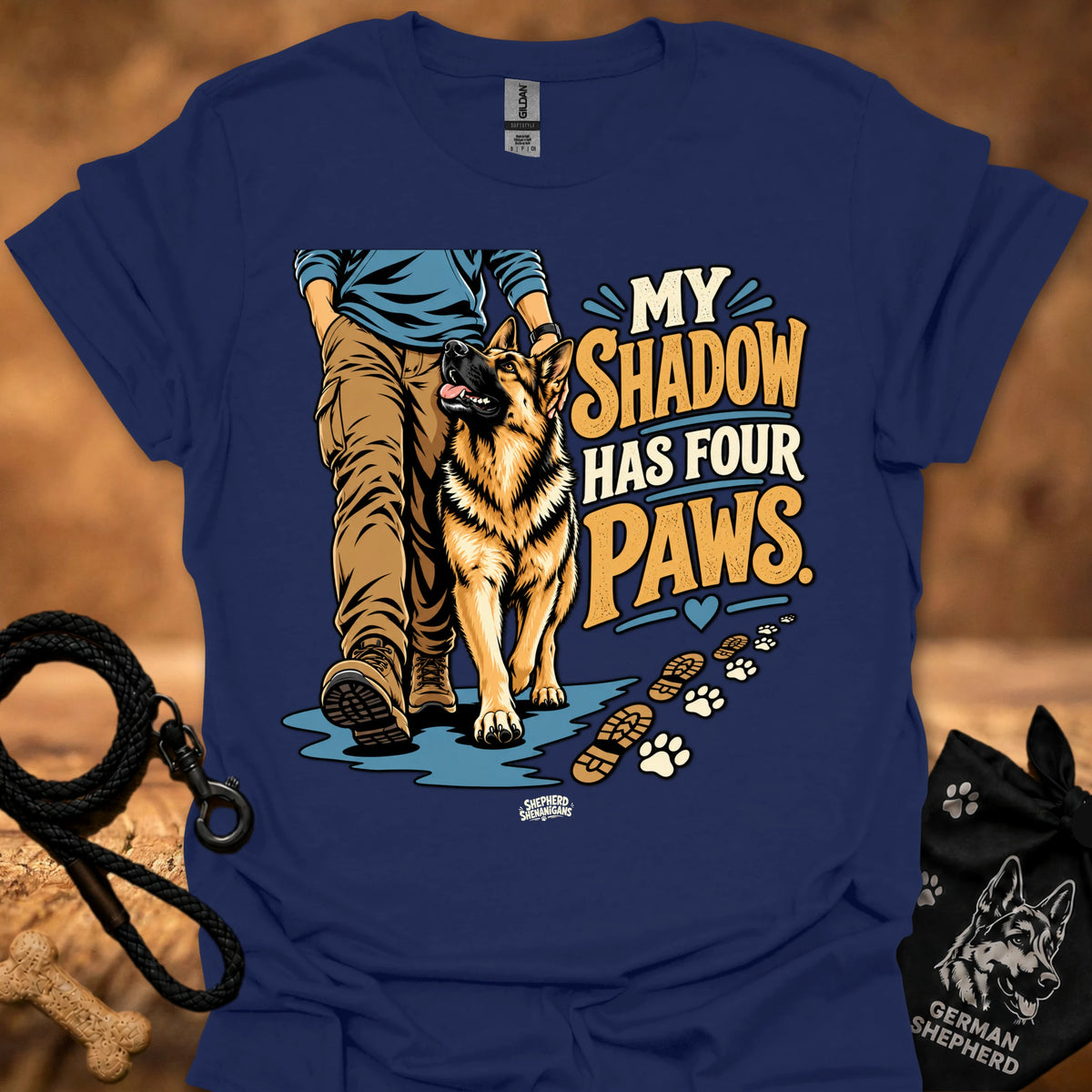 Royal blue T-shirt with dog graphic and “My Shadow Has Four Paws” text