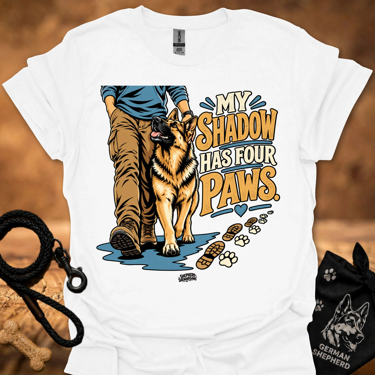 White T-shirt with dog graphic and “My Shadow Has Four Paws” text